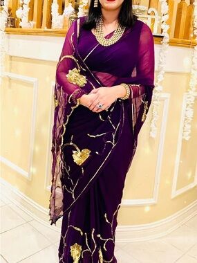 Elegant Purple Saree with Gold Embellishments